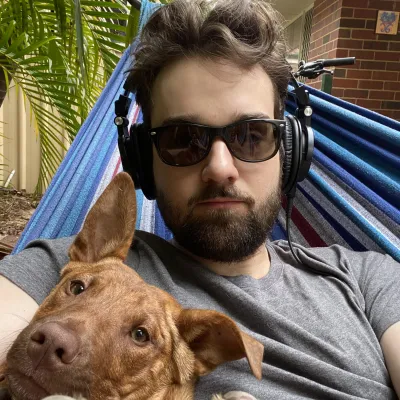 An awkward selfie of Kirk with an odd looking dog.